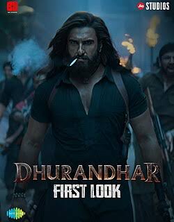 First look of the movie Dhurandhar featuring a muscular man with long hair holding a cigarette, set against a dramatic background with smoke and people in action.